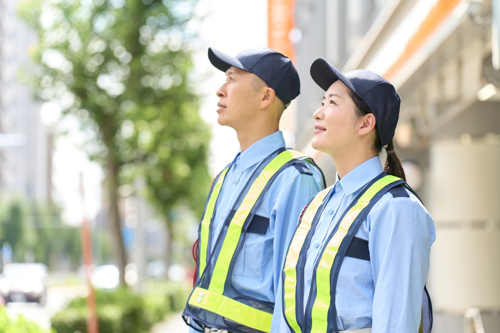 Asian men and women who work as security guards
